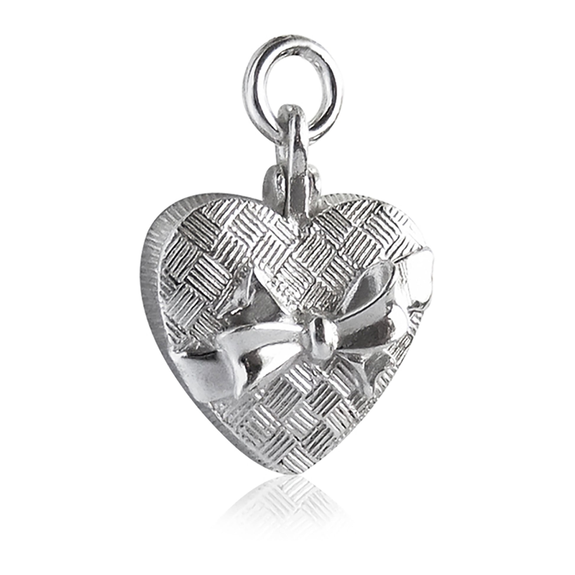 silver heart shaped chocolate box charm on a white background