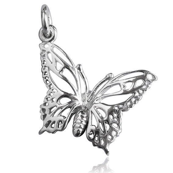 A silver filigree butterfly charm on a white background.