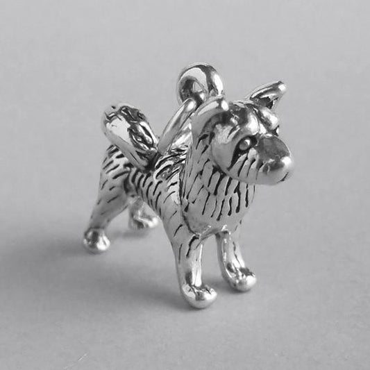 silver akita dog charm on grey background