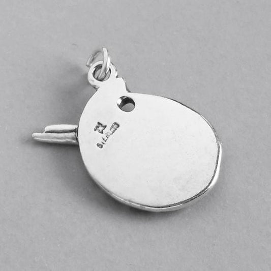 silver paint palette charm viewed from back on grey background