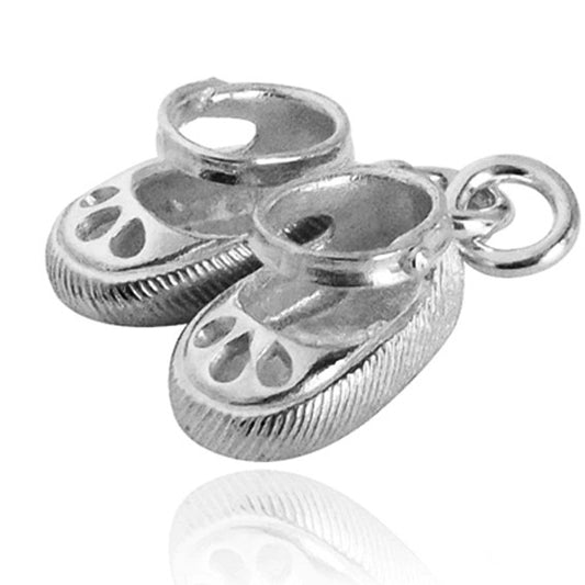 pair of baby shoes charm in silver against a white background