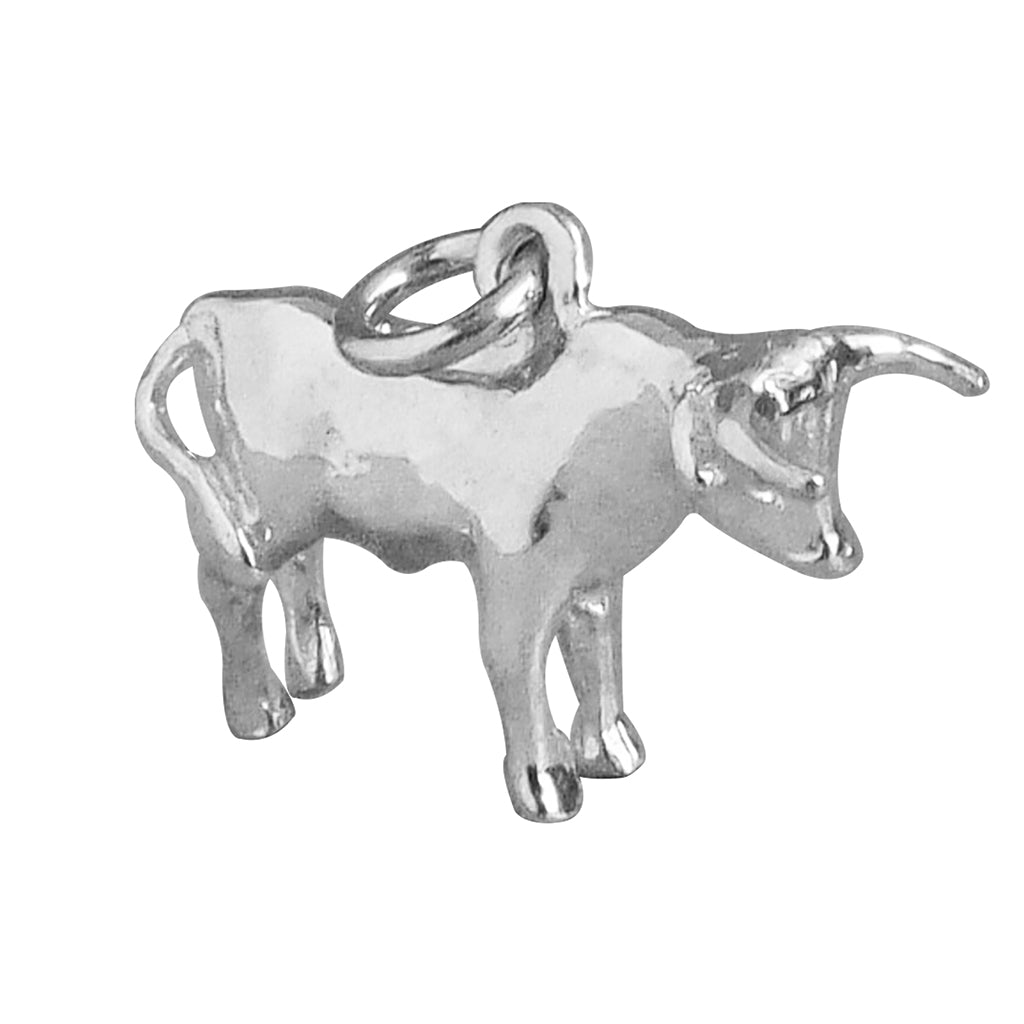 Sterling silver bull charm on white background