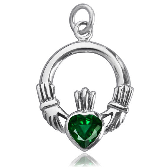 Sterling silver claddagh charm with green crystal on white background