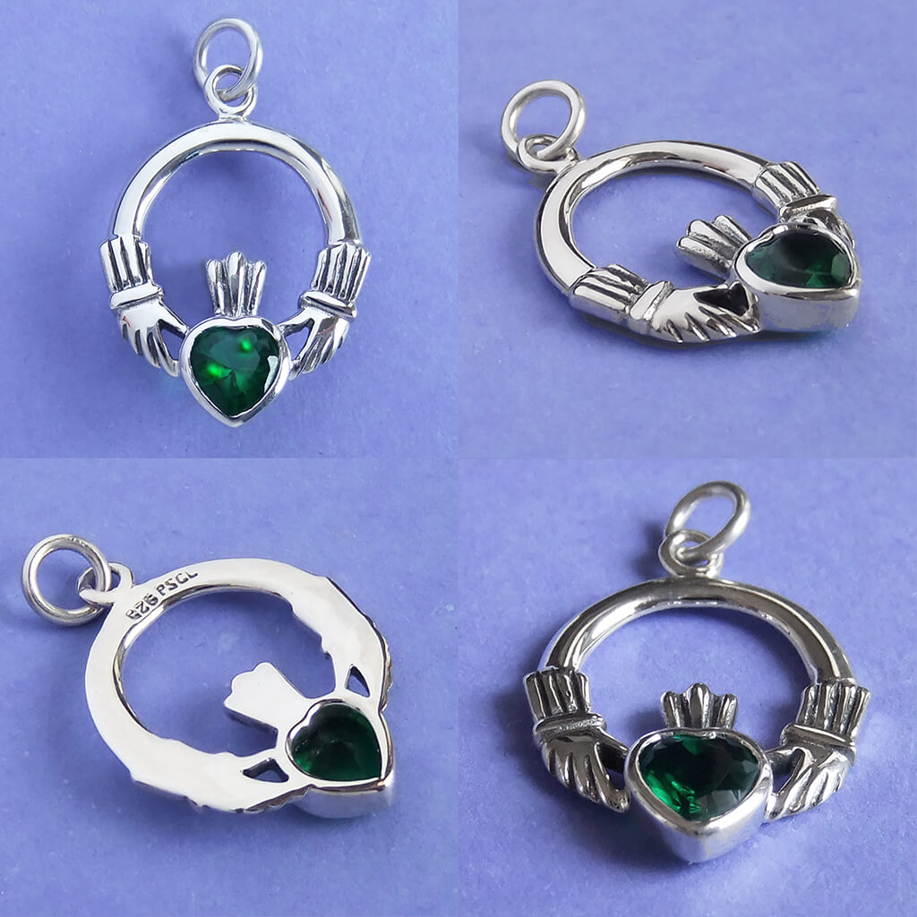 Sterling silver claddagh charm with green crystal on purple background