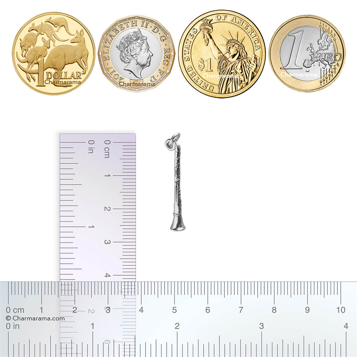 Sterling silver clarinet charm with coins and ruler for scale on white background