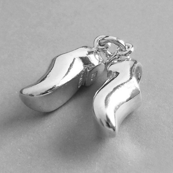 Sterling silver clogs charm on white background