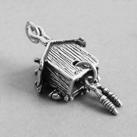 silver cuckoo clock charm rear view on grey background