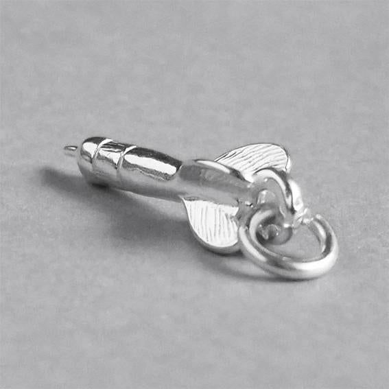 Sterling silver dart charm on a grey background