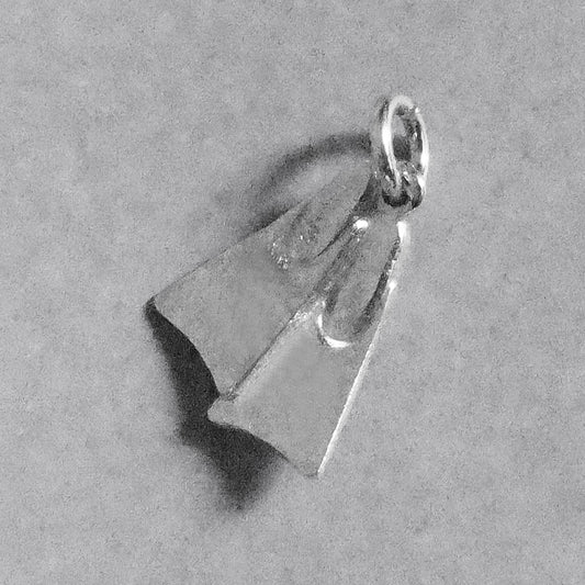 Sterling silver diving fins charm on a grey background