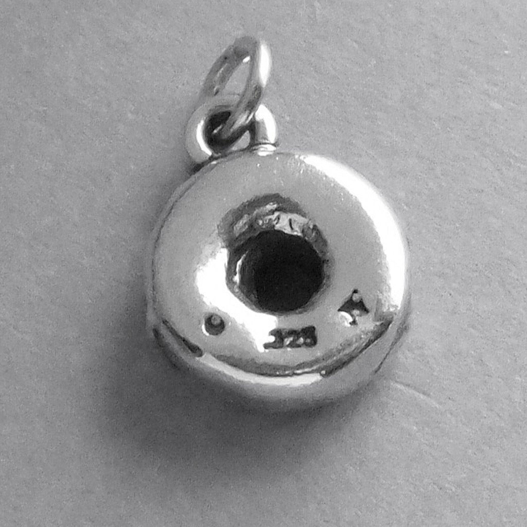 Sterling silver 3D donut charm on a grey background