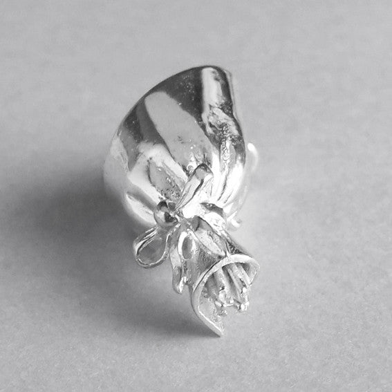 sterling silver bouquet of roses charm on a grey background
