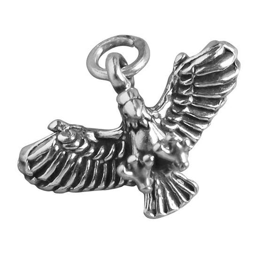 silver flying eagle charm on a white background