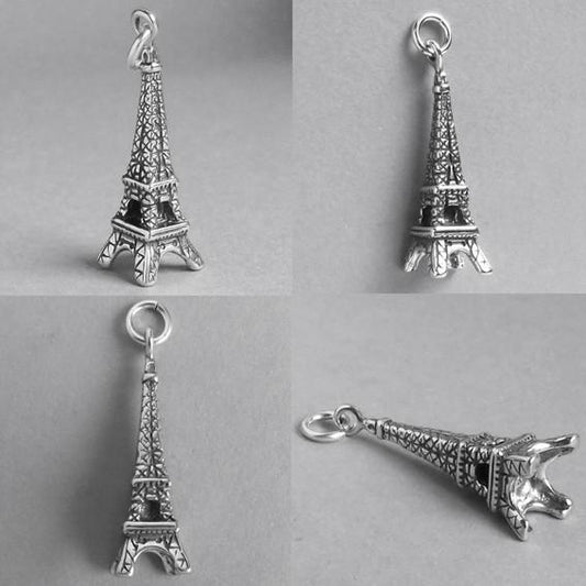 silver eiffel tower charm seen from different angles on grey background