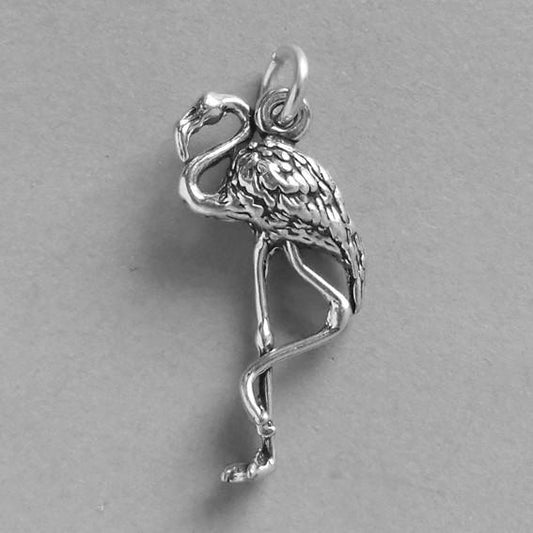 sterling silver flamingo charm on grey background