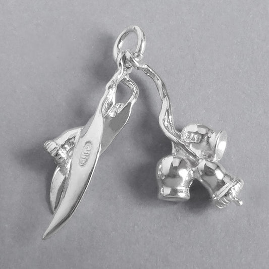Sterling silver eucalyptus charm on a grey background