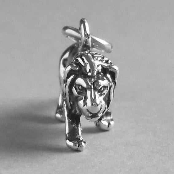 sterling silver prowling lion charm on grey background