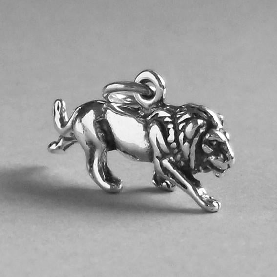 silver lion charm on grey background