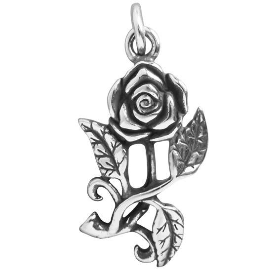silver rose charm on white background