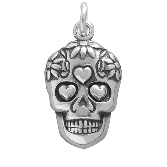 silver sugar skull charm on white background