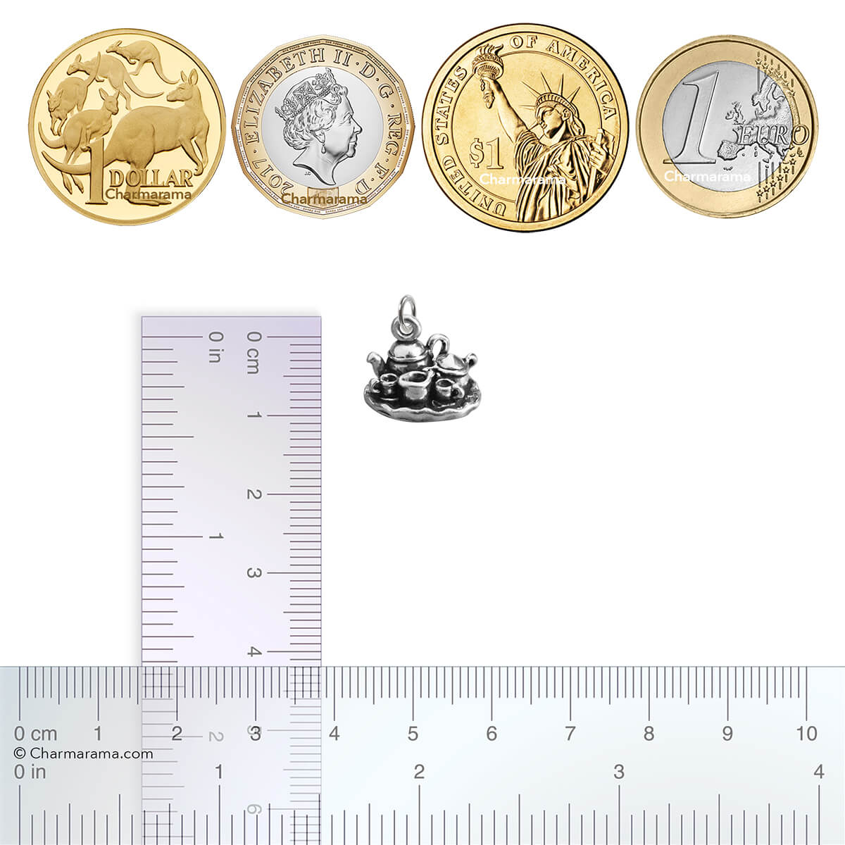 silver tea set charm with coins and ruler for scale