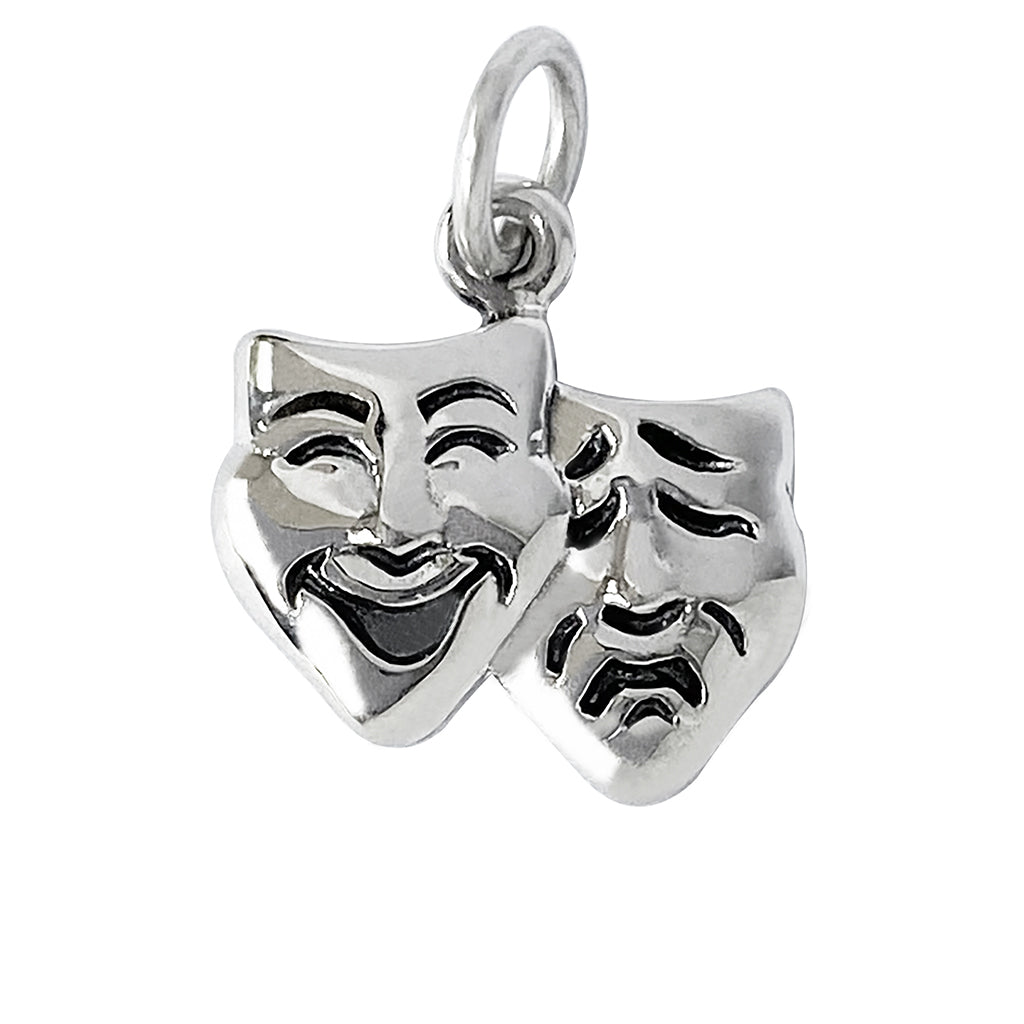 silver theatre masks charm on white background