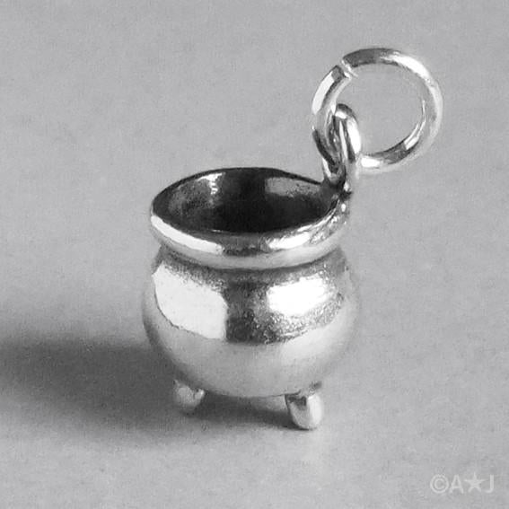 3D silver cauldron charm on grey background